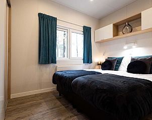 Slaapkamer in Module Flatroof vakantiehuis, Ede, Veluwe, Gelderland met comfortabele bedden.