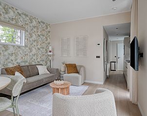 Comfortabele zithoek in Lindenhof vakantiehuis, Ede, Veluwe met moderne inrichting.