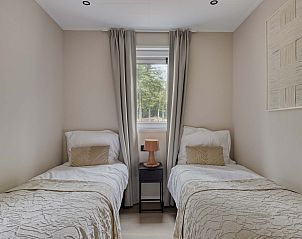 Tweede slaapkamer in Heidenhof vakantiehuis, Ede, Veluwe met eenpersoonsbedden.