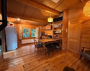 Cozy interior of Holiday cottage in Emst, Veluwe, Gelderland with wooden interior and spacious kitchen.