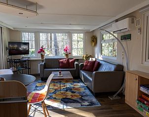Bright living space in Holiday Home in Emst, Gelderland, with comfortable sofas.