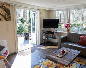 Bright living room in Holiday home in Emst, Veluwe, with access to the terrace.