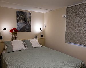 Cozy bedroom in Holiday Home in Emst, Gelderland, with comfortable bed.