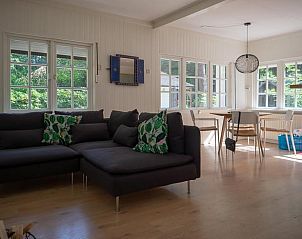 Cozy living room of Holiday home in Emst, Veluwe, with modern decor and lots of natural light in Gelderland.