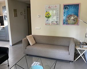 Cozy living room in Cottage in Emst, Veluwe, Gelderland, with comfortable sofa and modern furnishings for a relaxing vacation stay.