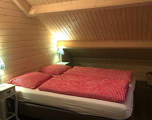 Vakantiehuisje in Emst verlicht in de nacht, Veluwe