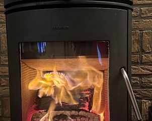 Cozy wood stove in Holiday home in Emst, Veluwe, Gelderland offers warmth and atmosphere in this charming vacation home.