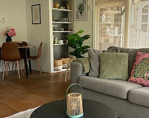 Atmospheric interior of Holiday Home in Ermelo, Veluwe, with comfortable sofa and decoration.