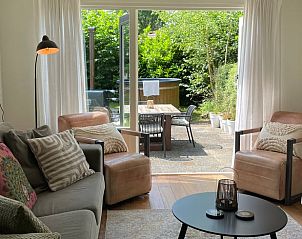 Bright living room in Holiday home in Ermelo, Veluwe, with access to the terrace.