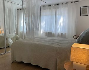 Spacious bedroom with large bed in Holiday home in Ermelo, Veluwe, for a good night's sleep.