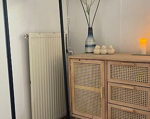 Stylish chest of drawers and decoration in Holiday home in Ermelo, Veluwe, for a homely atmosphere.