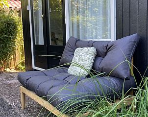 Comfortable deck chairs on the terrace of Holiday home in Ermelo, Veluwe, for relaxation.