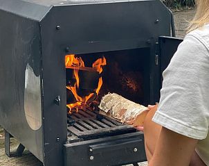 Wood stove in use at Holiday home in Ermelo, Veluwe, for a warm atmosphere.