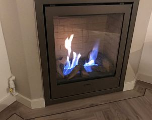 Cozy fireplace in Holiday Home in Ermelo, Veluwe, perfect for cold evenings.