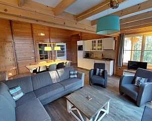 Cozy living room in Cottage in Ermelo, Veluwe, with comfortable seating area and wooden interior for a relaxing vacation stay.
