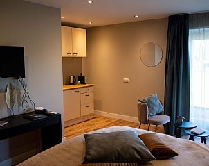 Gemtliche Sitzecke im Ferienhaus in Hoenderloo, Veluwe, mit moderner Ausstattung und gemtlicher Einrichtung.