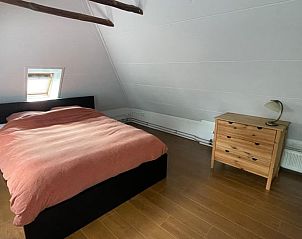 Gezellige slaapkamer in Huisje in Terwolde, vakantiehuis op de Veluwe, met comfortabel bed in Gelderland.