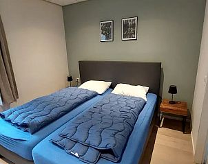 Comfortabele slaapkamer met tweepersoonsbed in Vakantiehuis in Garderen, Veluwe.