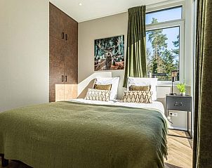 Gezellige slaapkamer met groen decor in Veluwe hoeve 5 personen, Garderen, ideaal voor een ontspannen verblijf op de Veluwe.