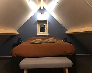 Gezellige slaapkamer met tweepersoonsbed in Vakantiehuis in 't Harde, Veluwe, Gelderland.