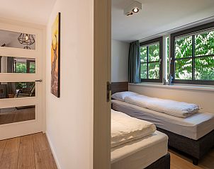Bedroom overlooking the garden in Holiday home Sprielderbosch 14 't Sprielderhof, Veluwe.