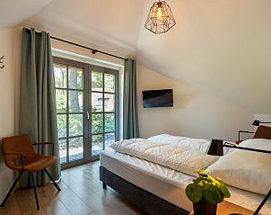 Bright bedroom with view in Holiday home Sprielderbosch 14 't Sprielderhof, Veluwe.