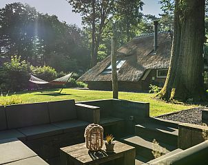 Luxury outdoor seating at Holiday home Sprielderbosch 28 'Berkenhoek' in the middle of the Veluwe.