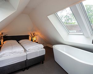 Exterior of Holiday home Sprielderbosch 28 'Berkenhoek' surrounded by Veluwe nature.