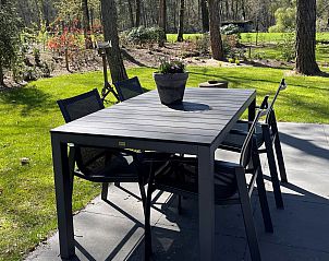 Outdoor table at Holiday home Sprielderbosch 26 De Beuk in Putten, Veluwe, ideal for outdoor dining.