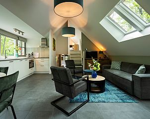 Spacious living room in Holiday home Sprielderbosch 26 De Beuk in Putten, Veluwe, with lots of natural light.