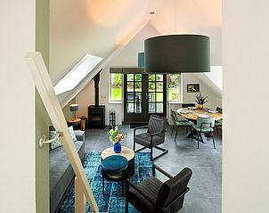 Overview of the living room in Holiday home Sprielderbosch 26 De Beuk in Putten, Veluwe, with open space.