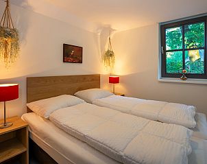 Schlafzimmer mit Gartenblick in Ferienhaus Sprielderbosch 23 De Zwijnenstal, Ferienhaus in Putten, Veluwe.