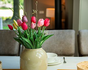 Cozy dining area with a view in Holiday home Sprielderbosch 25 'Mr. Owl' in Putten, Veluwe.