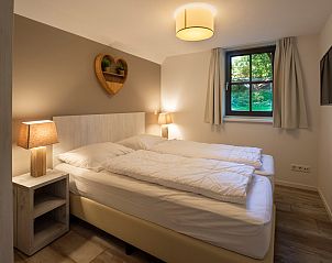 Comfortable bedroom in Vakantiewoning Sprielderbosch 25 'Meneer de Uil', located in Putten, Veluwe.