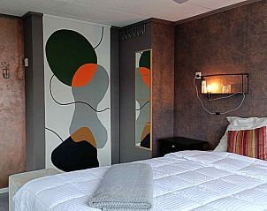 Eingang zum Ferienhaus DG1546 in Putten Veluwe mit moderner Architektur und natrlichen Materialien.