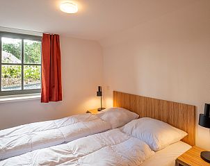 Comfortable bedroom in Holiday home Sprielderbosch 38 The Wooden Owl, overlooking the Veluwe nature.