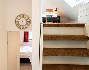 Stairs and clock in Holiday home Sprielderbosch 38 The Wooden Owl, Veluwe, Putten.