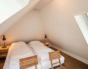 Attic room with beds in Holiday home Sprielderbosch 38 The Wooden Owl, Veluwe, Putten.