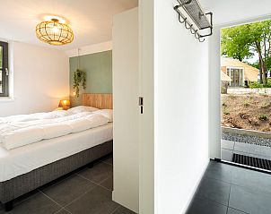 Trap naar de bovenverdieping in Vakantiewoning Sprielderbosch 44 Green Balance, vakantiehuis in Putten, Veluwe.