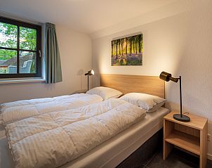 Schlafzimmer mit Aussicht in Ferienhaus Sprielderbosch 27 De Uitlaat in Putten, Veluwe, ruhige Umgebung.