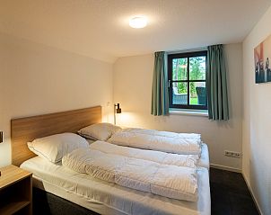 Gerumiges Schlafzimmer im Ferienhaus Sprielderbosch 27 De Uitlaat in Putten, Veluwe mit viel Tageslicht.