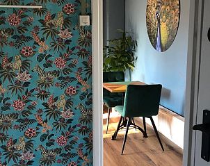 Stylish entrance to Holiday Home in Voorthuizen, Veluwe, with colorful wallpaper and dining room.