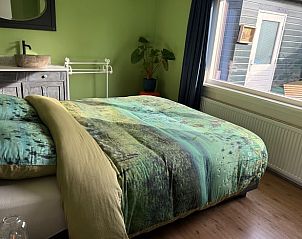 Spacious bedroom in Holiday home in Voorthuizen, Veluwe, overlooking the garden.