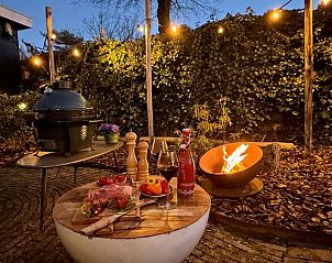 Outdoor space in Holiday Home in Voorthuizen, Veluwe, with barbecue and mood lighting.
