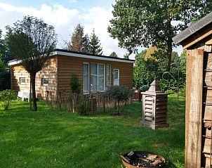 Rustikales Ferienhaus in Voorthuizen, Veluwe, umgeben von Wldern, bietet einen gemtlichen Platz zum Entspannen im Freien in Gelderland.