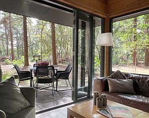 Relax at the Holiday Home in Voorthuizen, Veluwe, overlooking the forest from the cozy living room and inviting terrace.