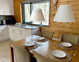 Cozy kitchen and dining area in Cottage in Voorthuizen, Veluwe, overlooking the nature of Gelderland.