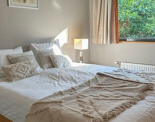 Bright bedroom in Holiday home in Voorthuizen, Veluwe, overlooking greenery.
