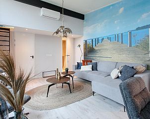 Stylish living room of vacation home Top-Nova Scotia in Voorthuizen, Veluwe. Comfortable seating area with nature theme for a relaxing stay.