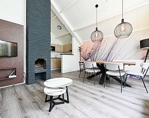 Gezellige woonkamer in vrijstaande woning Vaassen, Veluwe, met moderne inrichting.